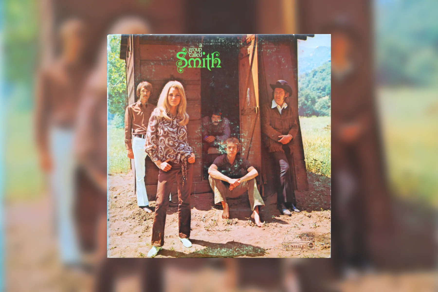 The 1969 Dunhill album cover for A Group Called Smith showing the band outside a weathered wooden building